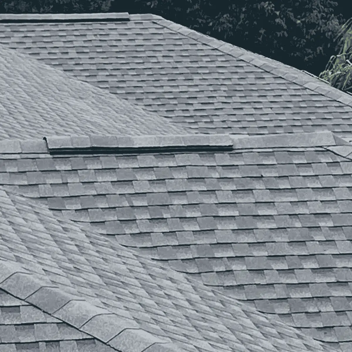 Row of townhomes documented after asphalt shingle roof replacement work to the condo.