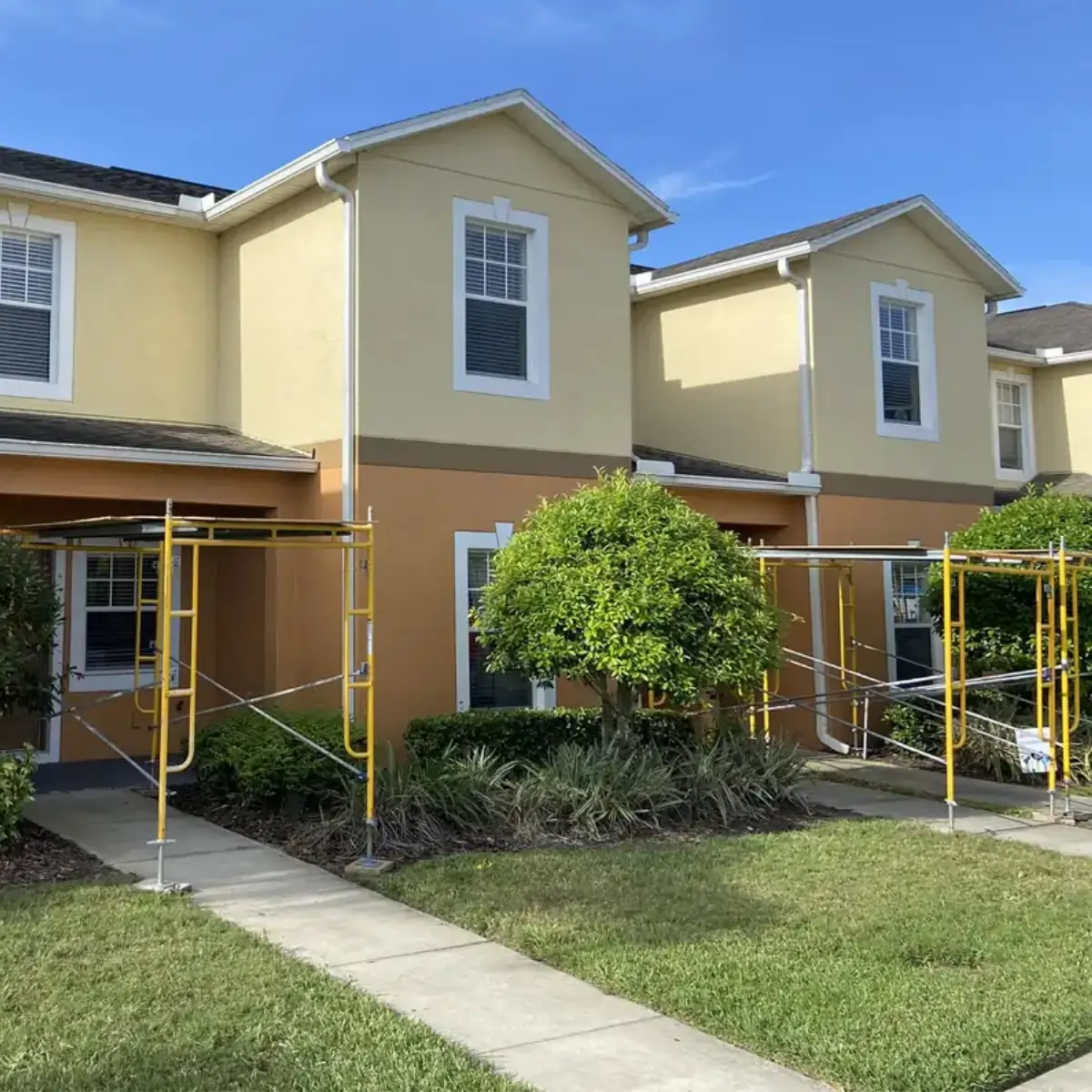Multiple protected entrances during a Central Florida multi-building roof replacement.