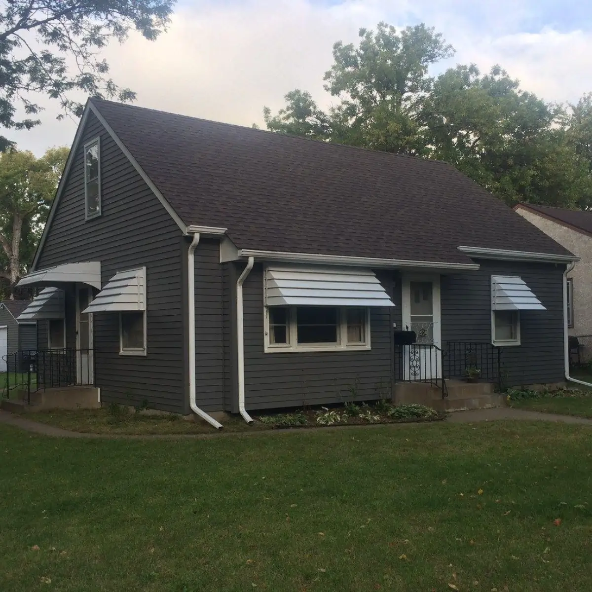 Lakeville home after — new blue-grey vinyl siding and trim, by Right Away Construction