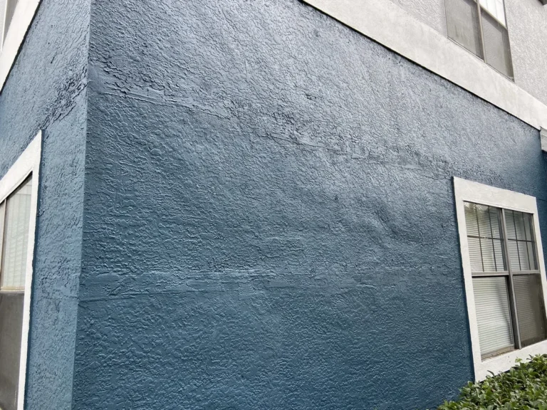 Repaired and re-textured stucco wall before painting