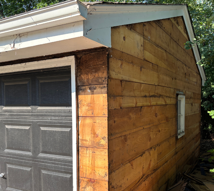 Siding install back garage window still there