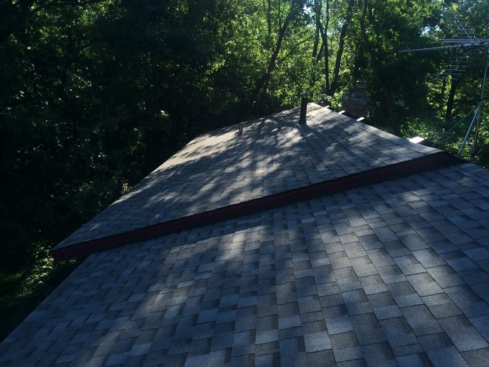 Close-up of new charcoal-gray architectural asphalt shingles installed in Maple Grove, MN by Right Away Construction