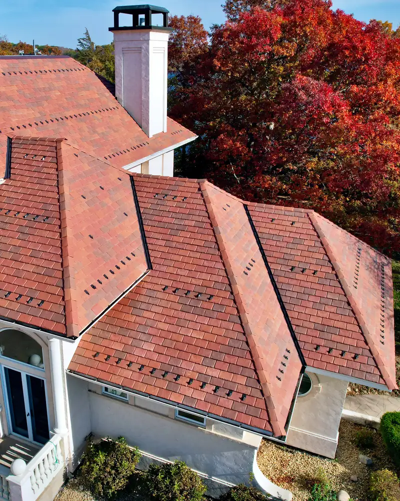 DaVinci synthetic slate roof above the columned front entrance of a north suburb Saint Paul home