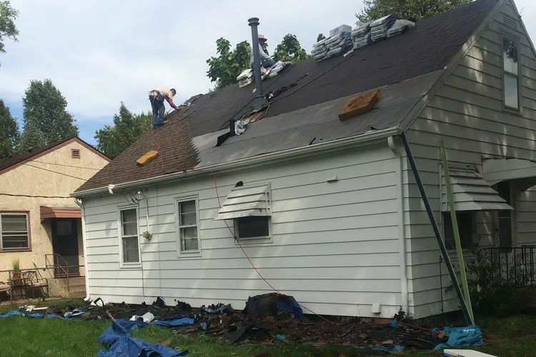 Right Away Construction crews working on a roof replacement in Blaine, Minnesota.