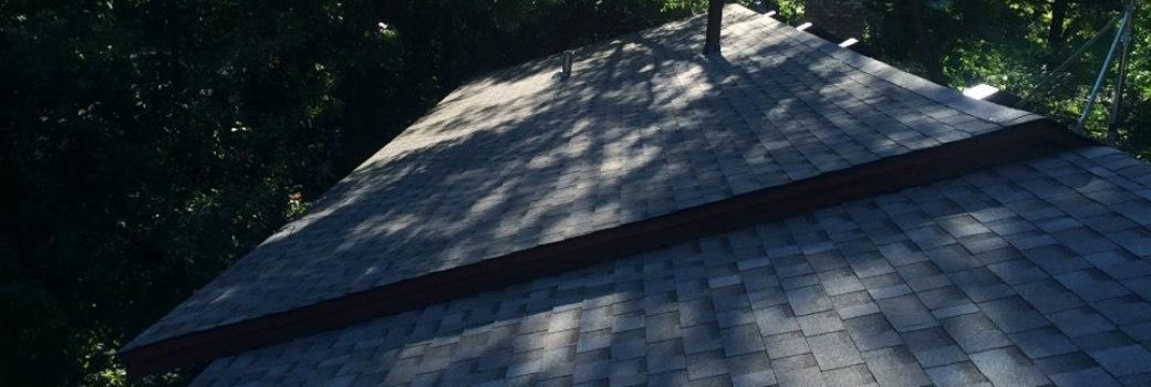 Close-up of new charcoal-gray architectural asphalt shingles installed in Maple Grove, MN by Right Away Construction