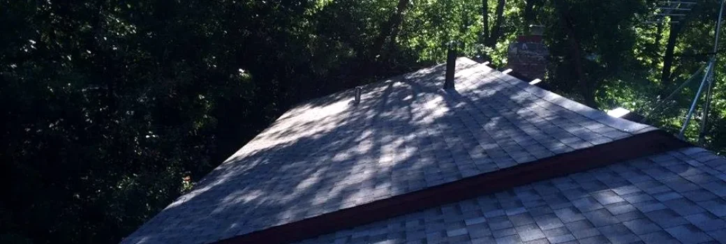 Architectural asphalt shingles along a ridge on a Maple Grove MN roof