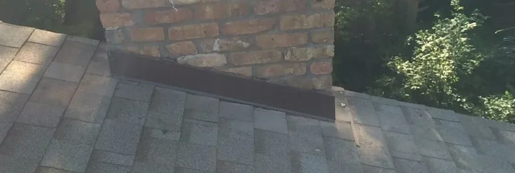 New chimney step and counter flashing on a roof in Minnetonka MN