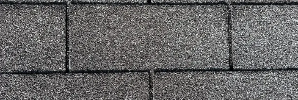 A photo of a grey shingle in St Anthony in July