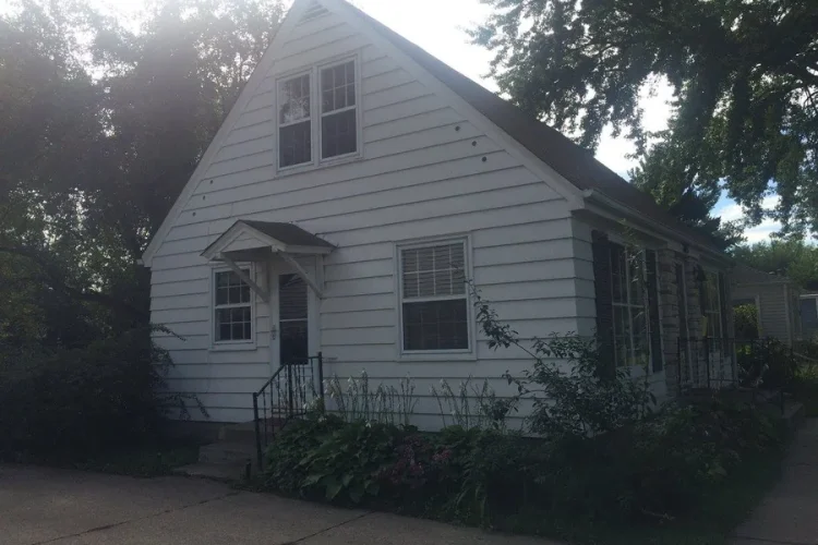 A Blaine MN home before siding, paint and roof replacement