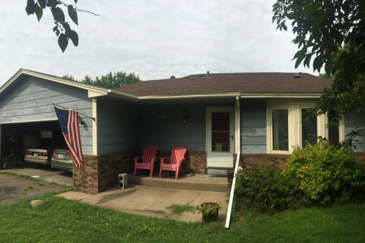 Blue Edina, MN rambler with a new brown architectural shingle roof installed by Right Away Construction