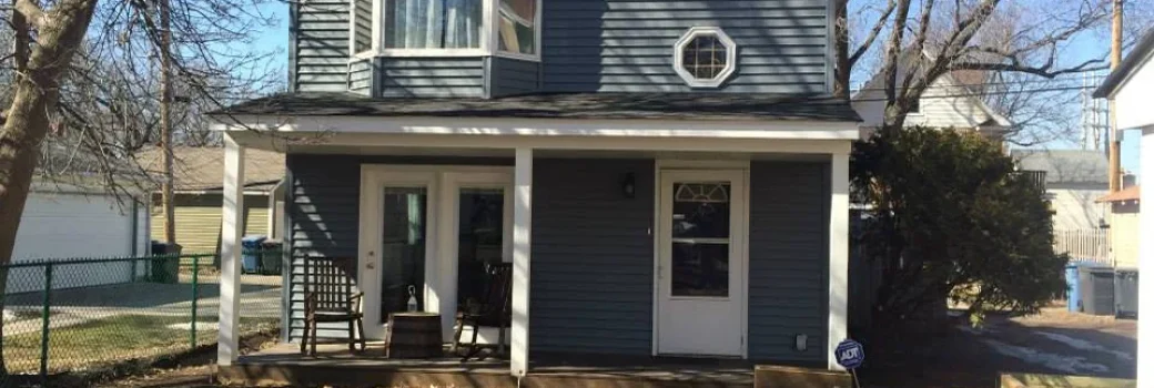 Lakeville MN home with new blue-gray vinyl siding and a covered front porch